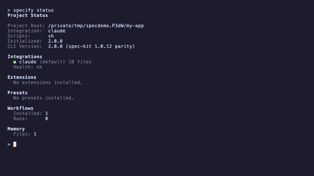 specify status: Project Root, Integration claude, Scripts sh, Initialized 2.0.0, CLI Version 2.0.0 (spec-kit 1.0.12 parity), then sections for Integrations (claude, default, 10 files, health ok), Extensions, Presets, Workflows (1 installed, 0 runs) and Memory (1 file)